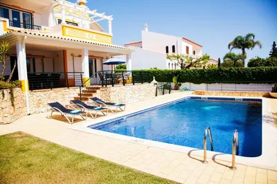 a living room with two couches and a tv at Villa Clara Premium by Sunny Deluxe in Albufeira