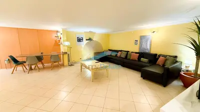 a woman sitting at a desk in a room at Villa Clara Premium by Sunny Deluxe in Albufeira