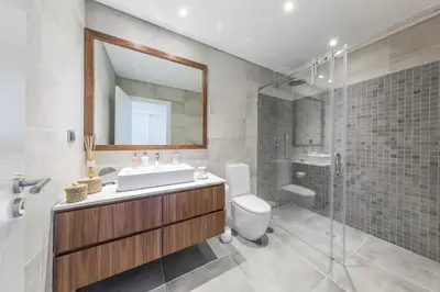 a bathroom with a sink and a toilet and a shower at NOA Apartment Quinta do Lago in Quinta do Lago