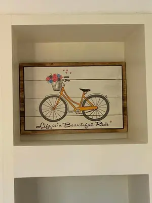 a framed picture of a bike on a wall at Quinta do Lago Golf in Quinta do Lago
