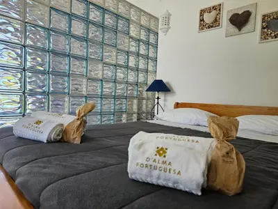 a hotel room with two bags on a bed at São Rafael Golden Pearl Haven in Albufeira