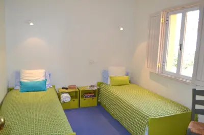 a small room with two beds and a window at TP Coral 1 - Marina Vilamoura Apartment in Vilamoura