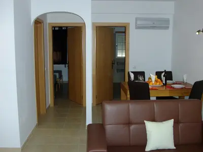 a living room with a couch and a table at Jazzy Cool Apartment Near White Sand Beaches in Albufeira