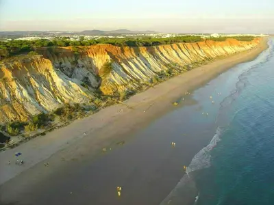 an aerial view of a beach with cliffs and the ocean at Deluxe Apartment H in Albufeira