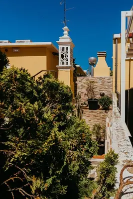 a clock tower on top of a building at Happy House in Faro