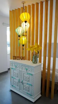 a bedroom with a white dresser with three lamps on it at Golden Cliff House in Albufeira