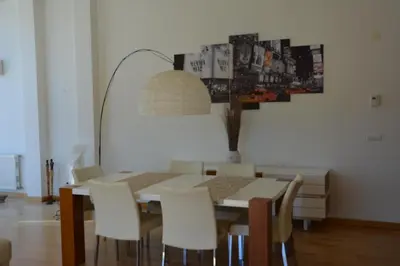 a dining room with a table and chairs at Penthouse Marina in Albufeira