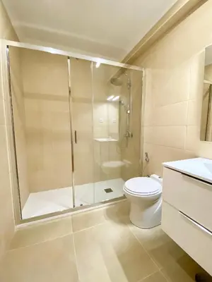 a bathroom with a shower and a toilet at Home Out Luxury Marina Apartment - 2 Bedrooms Sea View in Vilamoura