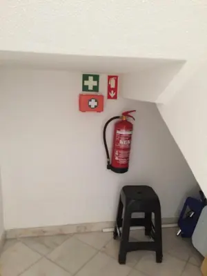 a room with a fire extinguisher on the wall at Villa V2 Duplex - Vilamoura Tennis in Quarteira