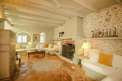 a living room with a couch and a fireplace at FLH Belaventura Villa in Boliqueime