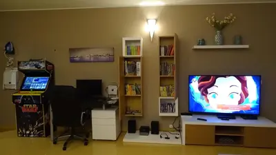 a living room with a flat screen tv and a desk at AlgarveFlat in Albufeira