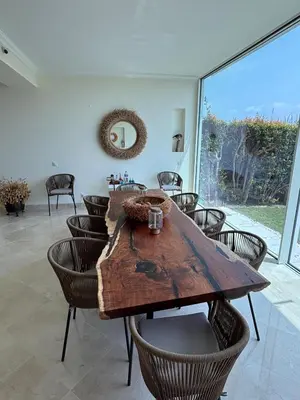 a kitchen with white cabinets and a sink and a window at Formosa Villas in Quinta do Lago