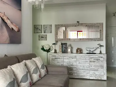a living room with a couch and a dresser at Apartment in Algarve,Vilamoura in Vilamoura