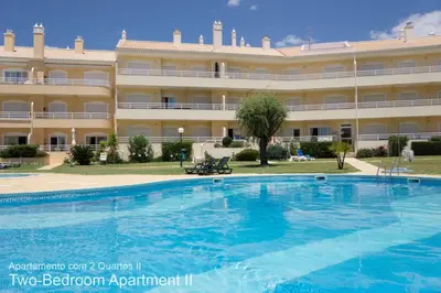 a large apartment building with a large swimming pool at Akisol Vilamoura Sun III in Vilamoura