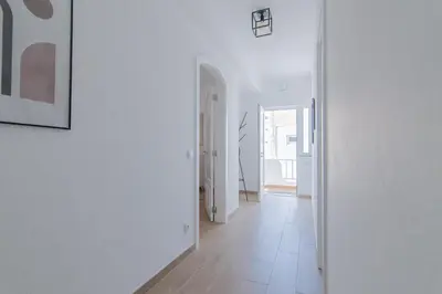 an empty hallway with white walls and a white floor at Apartments Salomé in Albufeira