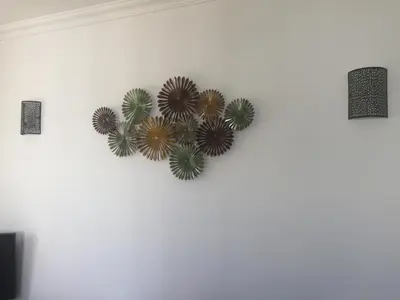 a wall with a heart made out of flowers at Mare Viva Beach Apartment in Quarteira