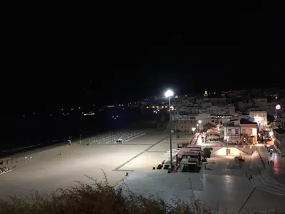 a large parking lot at night with a city at Bellavista Ténis Clube - Studio Sea View in Albufeira