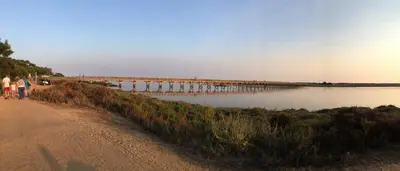 a group of people walking on a path next to a lake at Quinta Formosa - Villas in Quinta do Lago