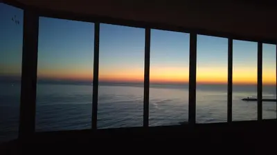 a view of the ocean from a window at 180° Sea View - Fabulosa vista mar! in Quarteira