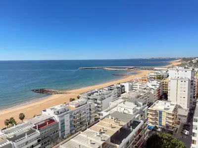 an aerial view of a beach and buildings at 180° Sea View - Fabulosa vista mar! in Quarteira