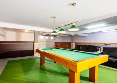 a billiard table in a room with a pool at Villa Alegria by Algarve Vacation in Albufeira