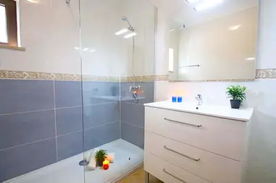 a bathroom with a shower and a sink at Villa Martinica by Algarve Vacation in Guia