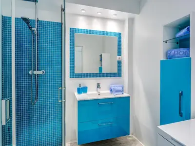 a blue bathroom with a sink and a shower at Studio Dream View 50m from the beach by Interhome in Albufeira
