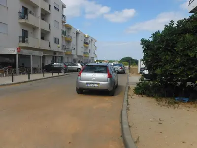 a silver car parked on the side of a street at Rooms_Heart Apartment in Faro