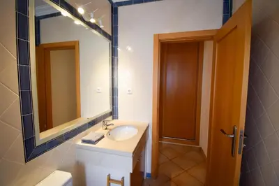 a bathroom with a sink and a mirror at Old Village Prestige 101 in Vilamoura