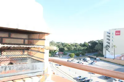 a view from the balcony of a building with a parking lot at Beach Center 2 - 300m beach in Albufeira