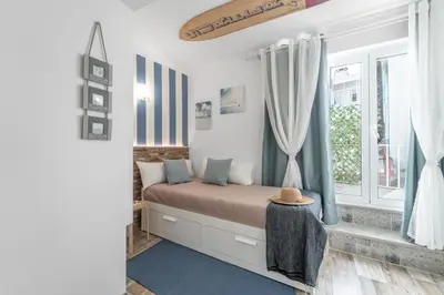 a bedroom with a bed and a window at Main Street Apartments by Raspberry Cascade in Faro