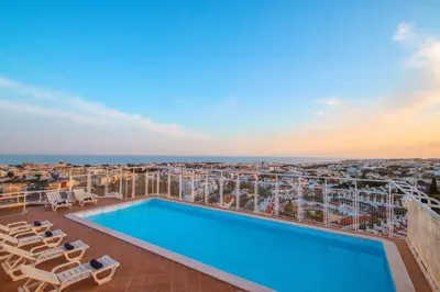a pool on the roof of a building with a view at Penthouse Miami by Algarve Vacation in Albufeira