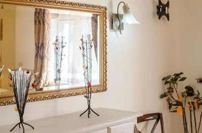 a bedroom with a large bed and a window at Quinta das Yuccas in Boliqueime