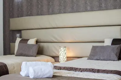 a bedroom with two beds and a window at Villa Mar in Almancil