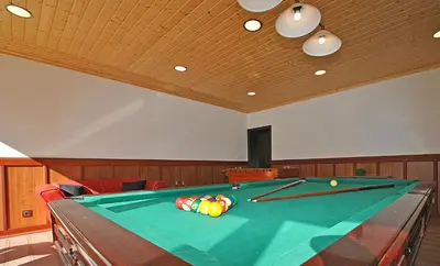 a pool table with balls on top of it at Villa Buddha by Algarve Vacation in Albufeira