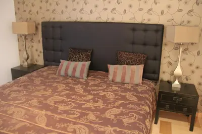 a bedroom with a large bed with two pillows at Marina Vilamoura Apartment in Vilamoura