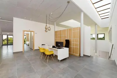 a dining room with a table and yellow chairs at Mercedes Country House in Faro