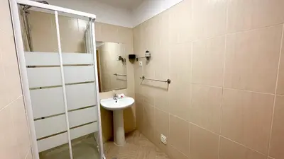 a bathroom with a sink and a mirror at Oura Lancemar by Sunny Deluxe in Albufeira