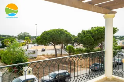 a balcony with a view of a parking lot at Laguna Formosa in Faro