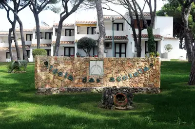 a stone wall in front of a building at Acoteias Beach Studio in Albufeira