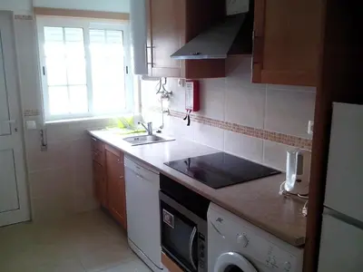 a small kitchen with a sink and a stove at Apartment with 1 Bedroom D in Albufeira
