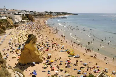 a crowd of people on a crowded beach at Apartment with 1 Bedroom D in Albufeira