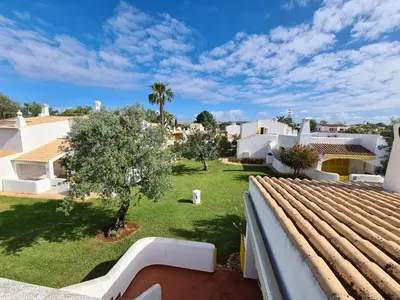 a view from the roof of a house with a yard at Aldeia do Golf - Vila I8 in Vilamoura