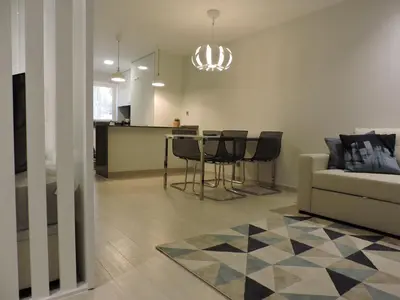 a living room with a couch and a table at Sao Rafael - Apartamento Studio in Albufeira
