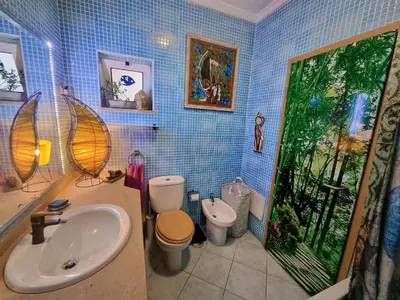 a bathroom with a sink and two toilets at T1 Falesia in Albufeira
