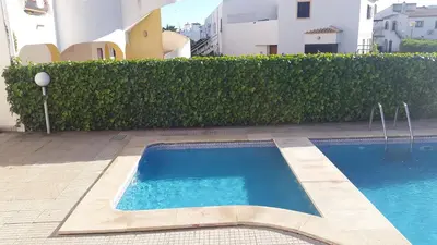 a swimming pool in the middle of a building at Tulipa Férias (29506) in Vilamoura