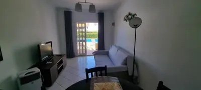 a living room with a couch and a television at Tulipa Férias (29506) in Vilamoura