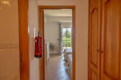 a hallway with a fire hydrant in a room at Casa Galé - Joia das Sesmarias 600mts praia in Albufeira