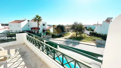 a balcony with a view of a street and buildings at Villa Golfinho by Sunny Deluxe in Albufeira