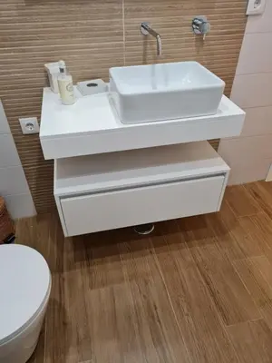 a bathroom with a white sink and a toilet at Victoria Studio in Vilamoura